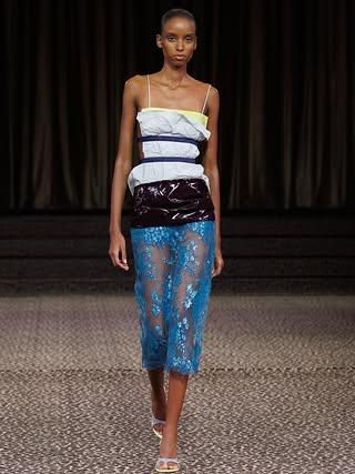 For spring summer 2027, Christopher Esber looks to the small language of dress, a pocket square, a cuff, a belt, a stud, and blows each detail out of proportion.

Familiar codes are enlarged, displaced and reconstructed, becoming the very architecture of the clothes. Elongated tailoring, exploding cuffs, high-split a-line skirts, sculptural belts and fluid lace blur the line between construction and disruption.

Menswear meets lingerie, structure meets transparency, with ceramic-coated lace, sheer georgette, shredded leather and archival 1950s studs bringing tension to the silhouette.

In collaboration with artist Anna Studeli, collage imagery is translated onto satin-backed PVC, adding another layer between the familiar and the abstract.

Presented beneath an oval skylight in an underground Paris theatre, across leopard carpet, Christopher Esber’s ss27 is a study in how one small detail can shift the entire shape of a garment.

Creative Direction @christopher_esber 
Styling @ilona_hamer 
Production @twotwenty_production
